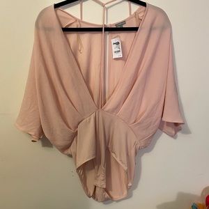 Light pink body suit